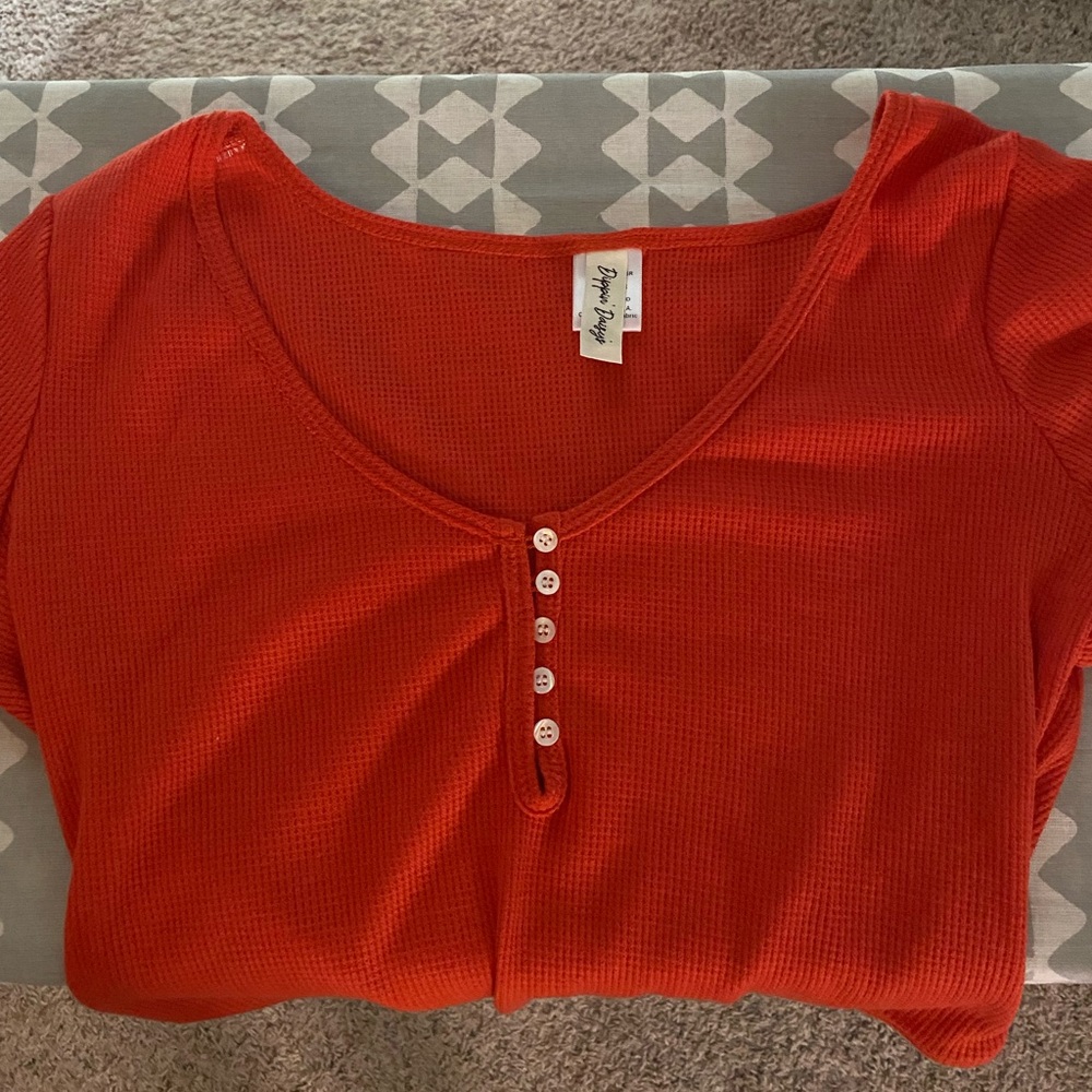 Dippin Daisy red body suit. Express